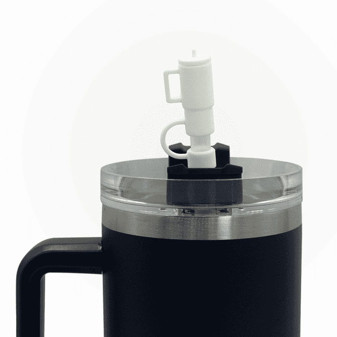 A drink bottle featuring a black exterior, clear lid, and a white nozzle, along with a handle and logo.
