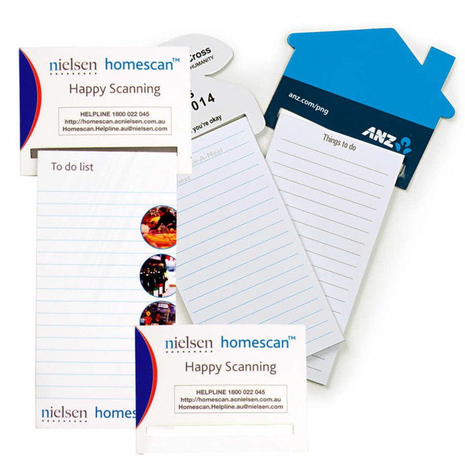 A magnetic to-do list in white, featuring lined pages and a branding logo, alongside a blue house-shaped notepad.