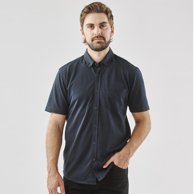A navy blue men's short sleeve knit shirt with a button-up front and a single chest pocket.