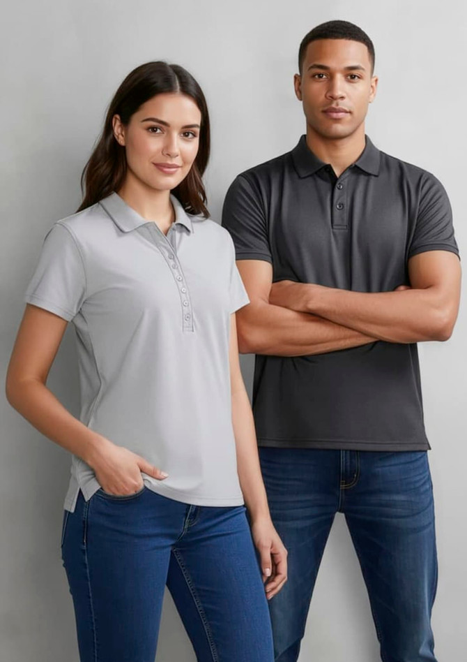 A grey women's short sleeve polo shirt featuring a collar and button placket, accompanied by a model in a dark polo shirt.
