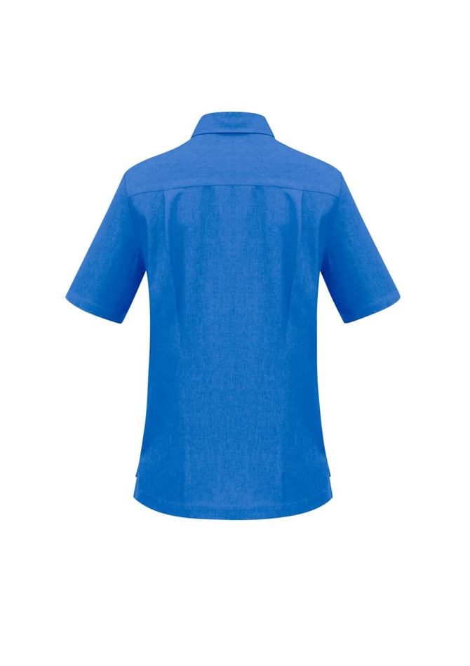 A blue overblouse with short sleeves and a collar, featuring a back yoke and subtle texture. It includes a logo.