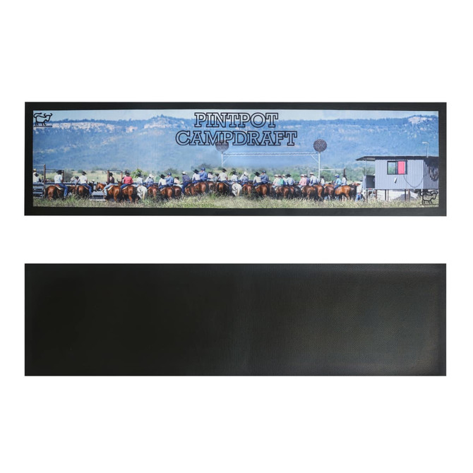 A long counter mat featuring a vibrant outdoor scene with horses and riders, predominantly in green and brown tones.