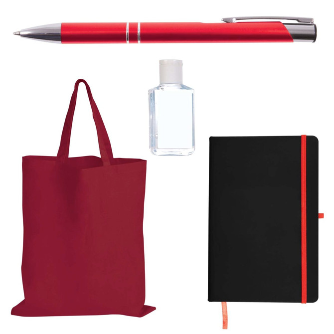 A red tote bag, a silver and red pen, a clear hand sanitizer bottle, and a black notebook with an orange elastic band.