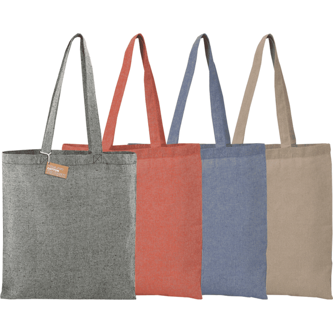 A selection of four tote bags in grey, red, blue, and beige, each with long handles and a label.