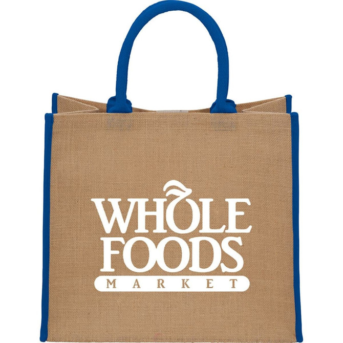 A large beige jute tote bag with blue handles and a logo on the front.