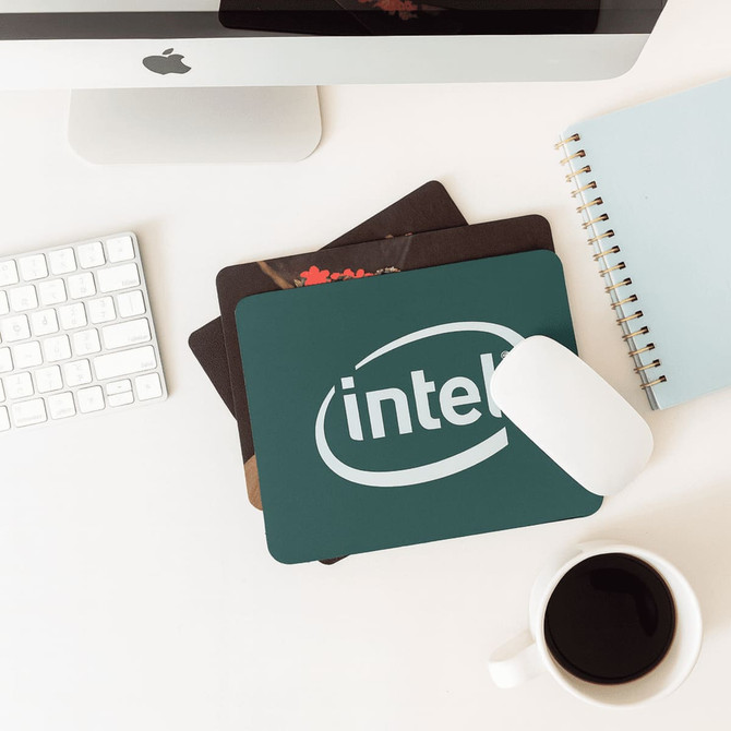 Three fabric mouse mats in various designs and colours, including one with an Intel logo.