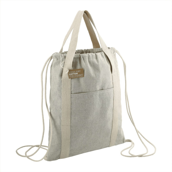 A light grey recycled cotton drawstring bag with two straps and a front pocket. It features a logo on the side.