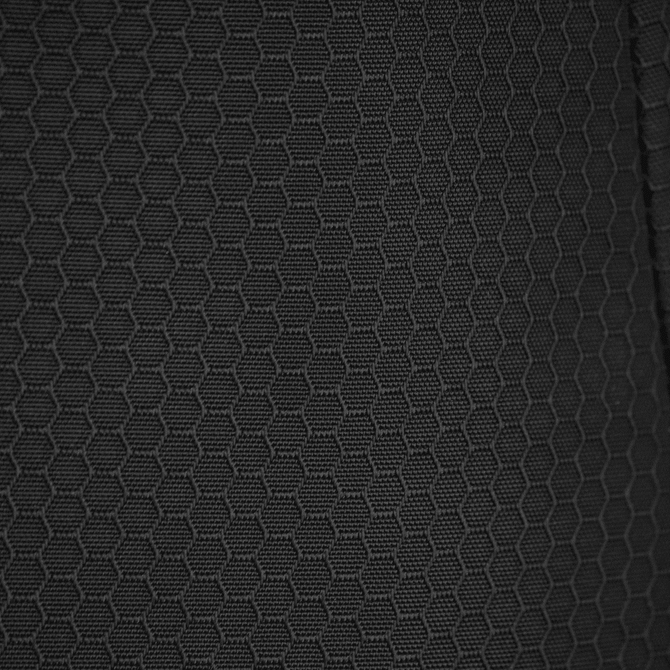 A textured black fabric featuring a hexagonal pattern, suitable for duffle bags and backpacks.