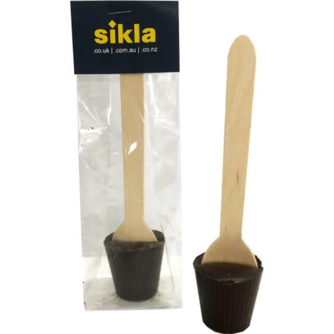 A chocolate spoon with a wooden stick, presented in clear packaging, featuring a logo at the top.