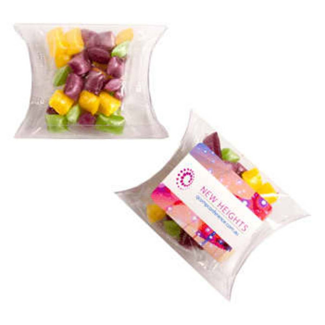 A Pillow Pack filled with colourful humbugs in purple, yellow, and green, with a transparent outer packaging.