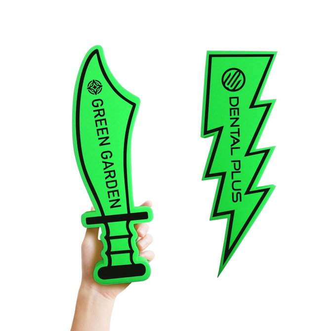 Two green foam cheer sticks in the shapes of a sword and a lightning bolt, held in a hand.