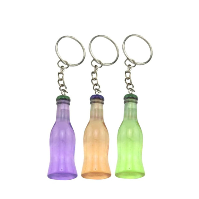 Three custom-shaped resin keychains in purple, orange, and green, each resembling a drink bottle, attached to metal key rings.