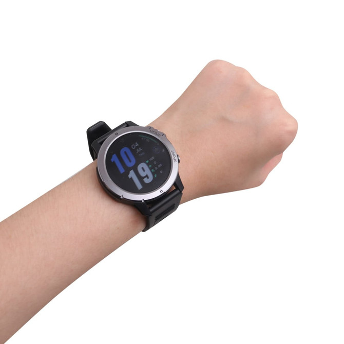 A round black smart watch is displayed on a wrist, featuring a digital screen with blue numbers.