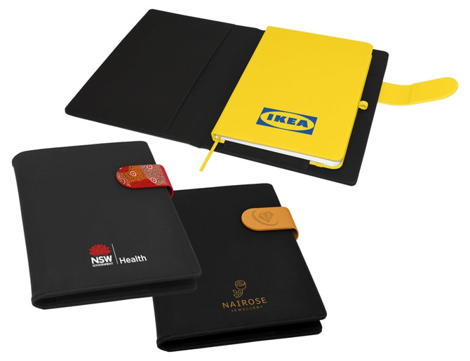 A multi-coloured portfolio featuring a yellow notebook, a black cover with a logo, and decorative closures.