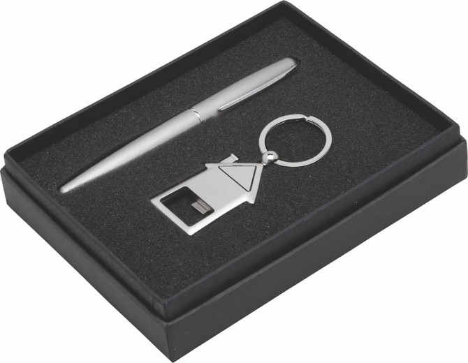 A silver pen, a metal keyring in the shape of a house, and a gift box with a black interior.