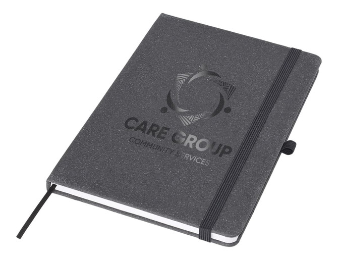 A black A5 notebook with an elastic band and a logo on the cover, featuring a textured finish.