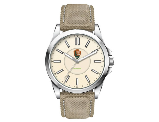 A unisex watch featuring a silver case, cream face, and a khaki rPET strap; includes a logo on the dial.