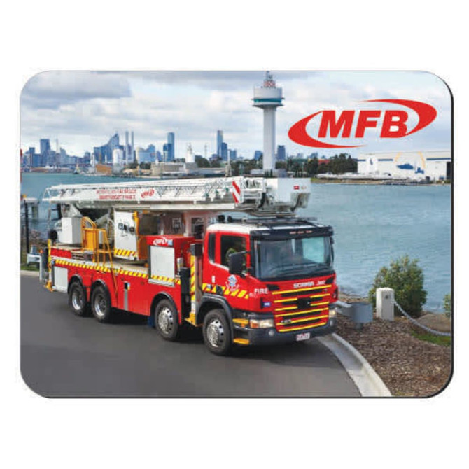 A mouse mat featuring a red fire truck parked near a waterfront with a city skyline in the background. It has a logo.
