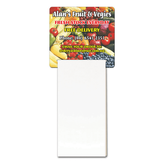 A magnetic calendar featuring a colourful fruit and vegetable design at the top and a blank notepad section below.