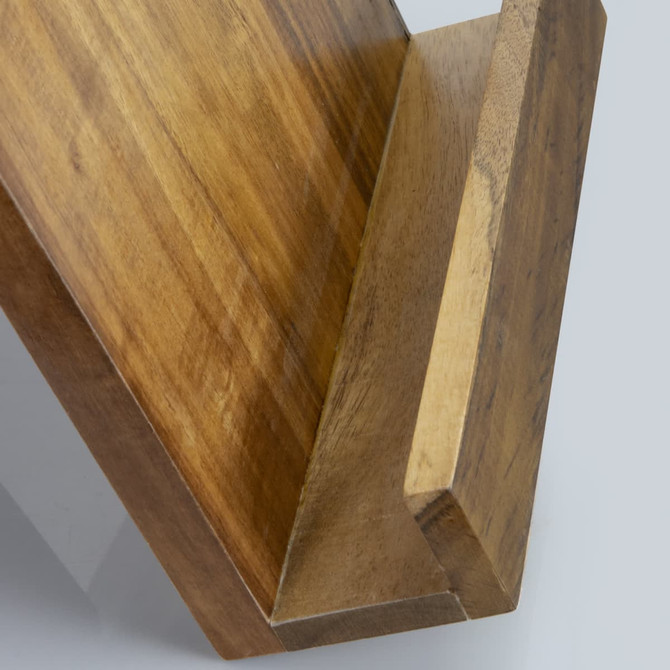 A wooden recipe book holder in a warm tone, featuring a slanted design for easy page viewing.