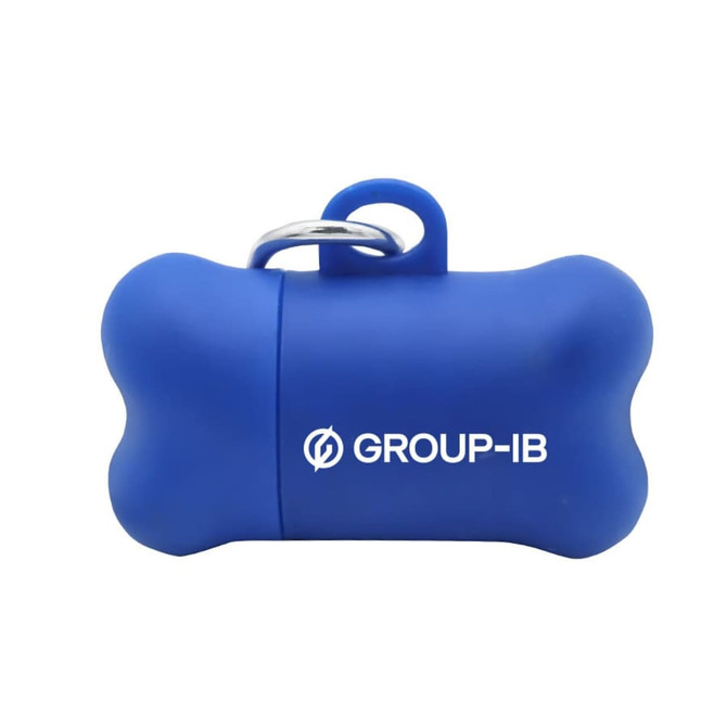 A blue bone-shaped dog waste bag dispenser with a keyring attachment and a logo.