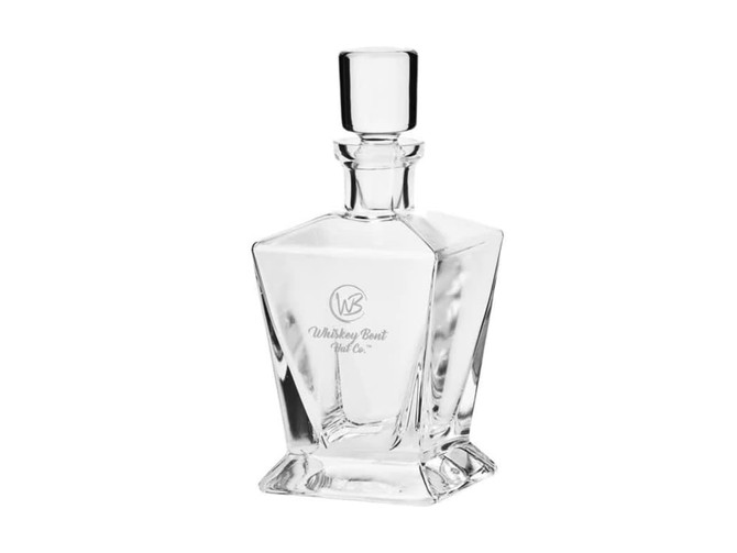 A drink bottle in a clear, geometric glass design featuring a round stopper and a logo.