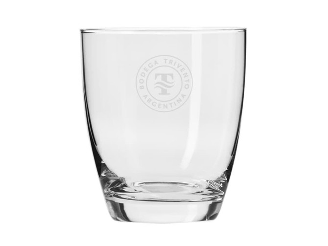 A clear glass tumbler with a round base, featuring a logo on one side. Part of a 6-piece boxed set.
