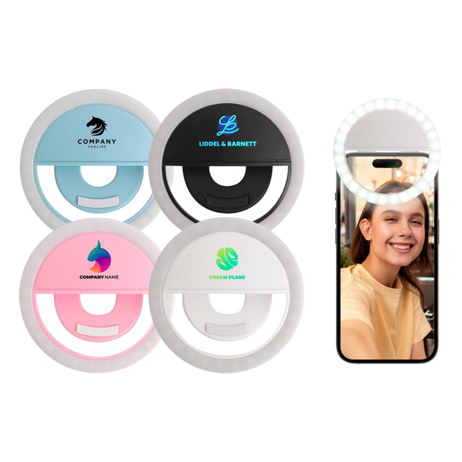 A set of four ring selfie lights in pink, blue, black, and white, along with a smartphone displaying one in use.