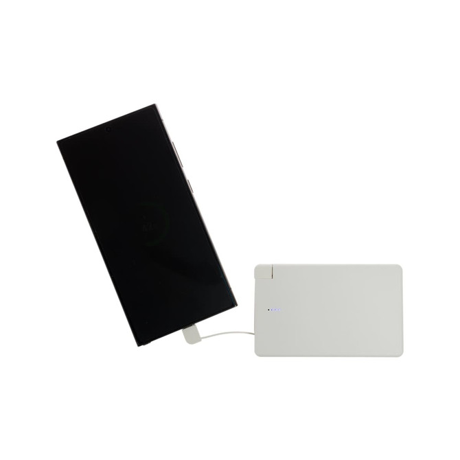 A white power bank is connected to a smartphone, showcasing a sleek design and charging capability.