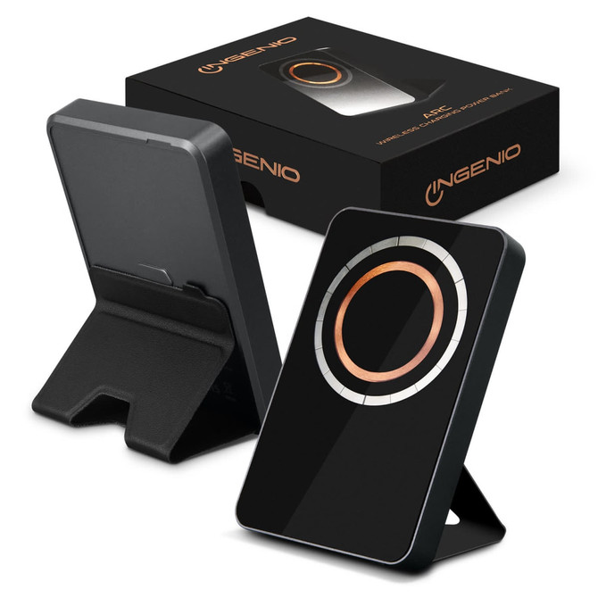 A black wireless charging power bank with a copper circle design, displayed alongside its packaging.