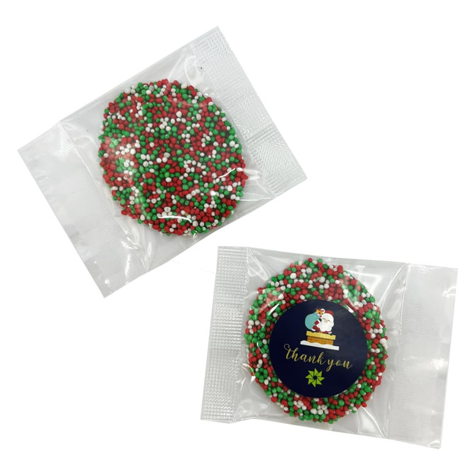 A cellophane bag containing chocolate freckle treats, decorated in red, green, and white sprinkles. Features a logo.