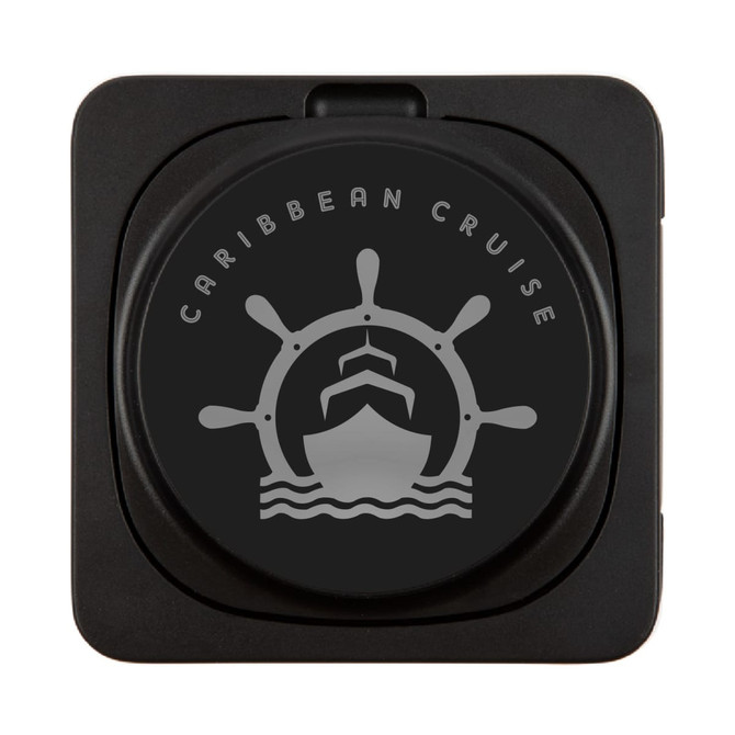A black wireless charger featuring a ship's wheel and silhouette of a ship. It includes a logo.