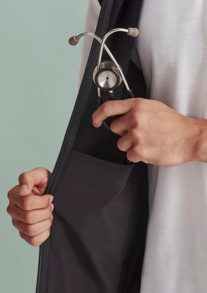 A black vest with a zip front featuring a pocket holding a stethoscope.