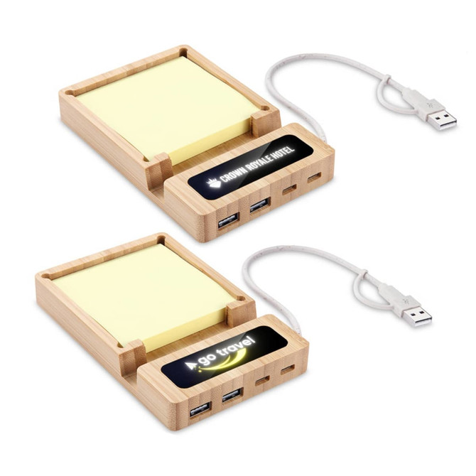 A bamboo USB hub with sticky note pad, featuring two USB ports and a connecting cable. It includes a logo.