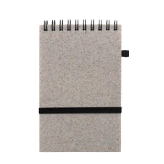 A6 notebook made from recycled wheat straw, featuring a black elastic band and a spiral binding.