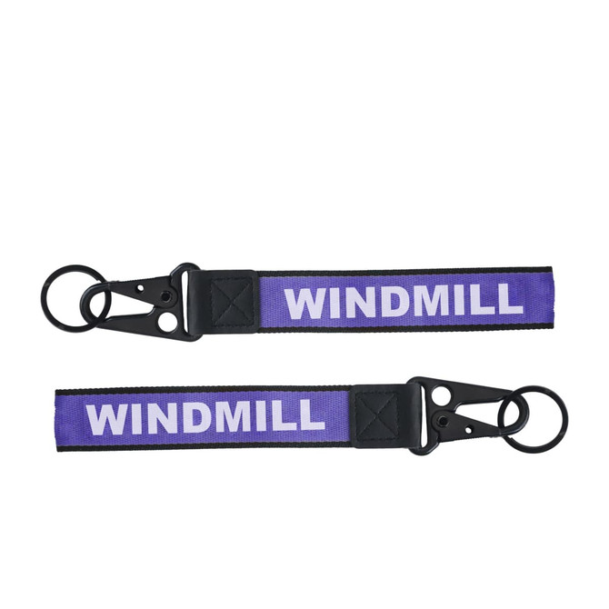 A purple Jacquard keyring featuring a black clip and two keyring loops. It has a branding element.
