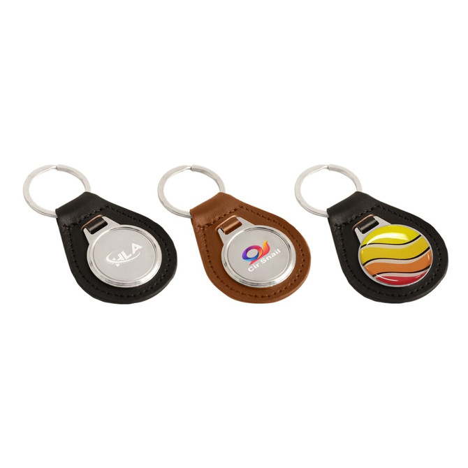 Three PU leather keyrings in black, brown, and featuring a multicoloured design, each with a metal ring.