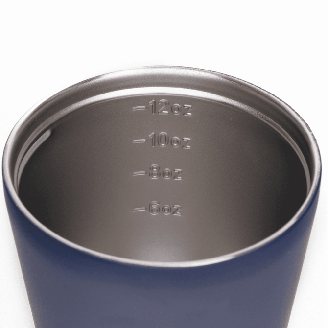 A drink bottle with a double-walled design, featuring a navy blue exterior and measurement markings inside.