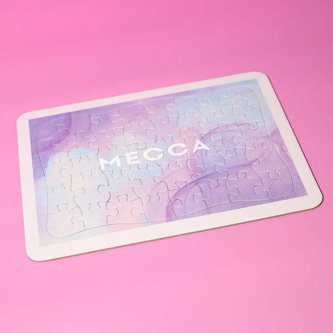 A jigsaw puzzle featuring soft pastel colours with a smooth surface. The puzzle has a logo on it.