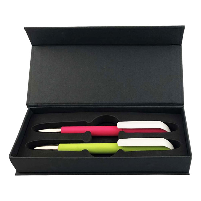 A gift box containing two plastic pens, one pink and one green, with a sleek black outer casing.