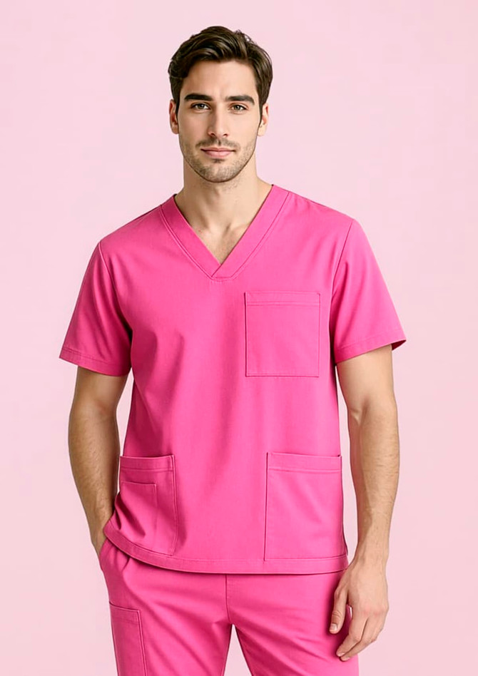 A unisex pink V-neck scrub top featuring short sleeves and multiple pockets, presented against a light pink background.
