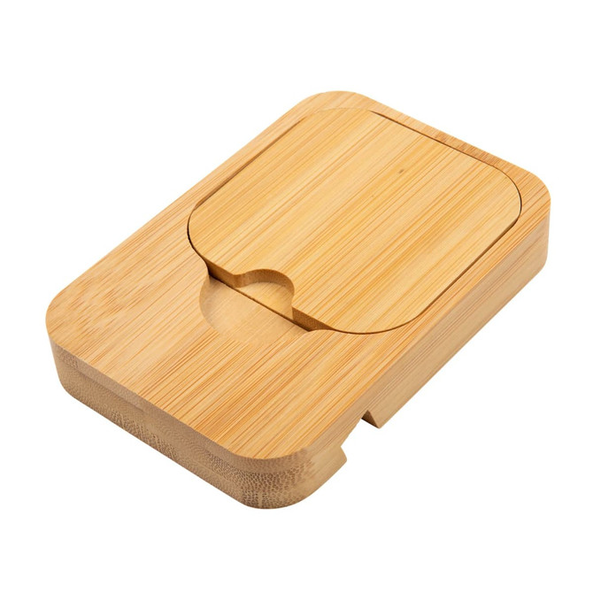 A bamboo charging station featuring a sleek, minimalist design and an indented area for a phone or device.