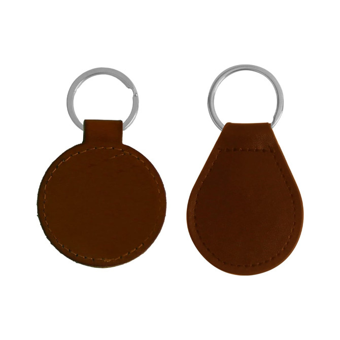 Two classic PU leather keyrings in brown, one round and one teardrop shape, with silver metal key rings.