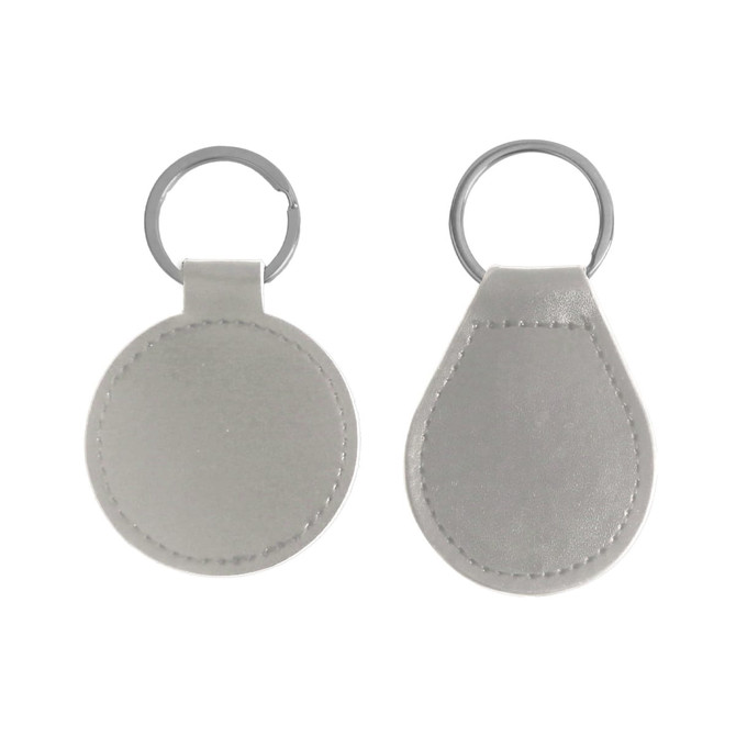 A silver PU leather keyring featuring a round and a teardrop shape, with a metal ring for attachment.