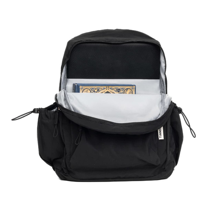 A black backpack opened to reveal storage space, including a compartment for a notebook. The interior is grey and includes a logo.