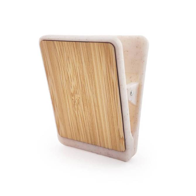 A magnetic clip with a bamboo front and a white plastic backing, featuring a simple design and a mounting option.