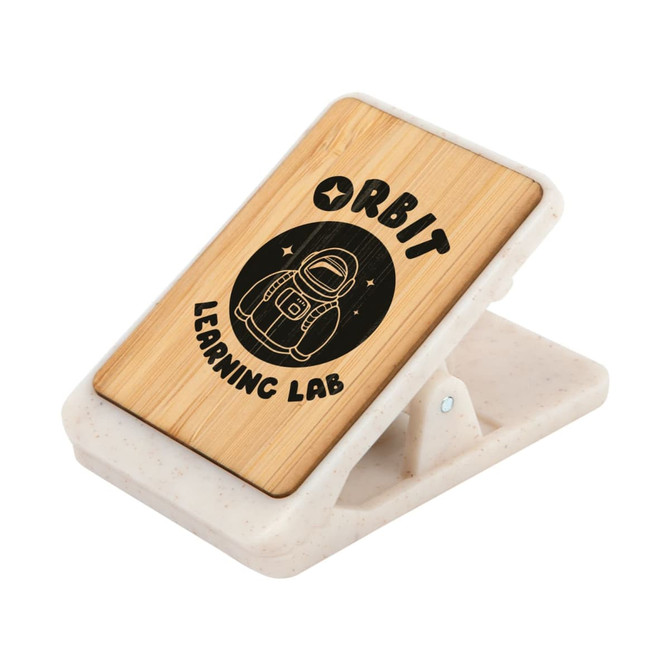 A bamboo magnetic clip with a white base, featuring a graphic of a space-themed design and branding.