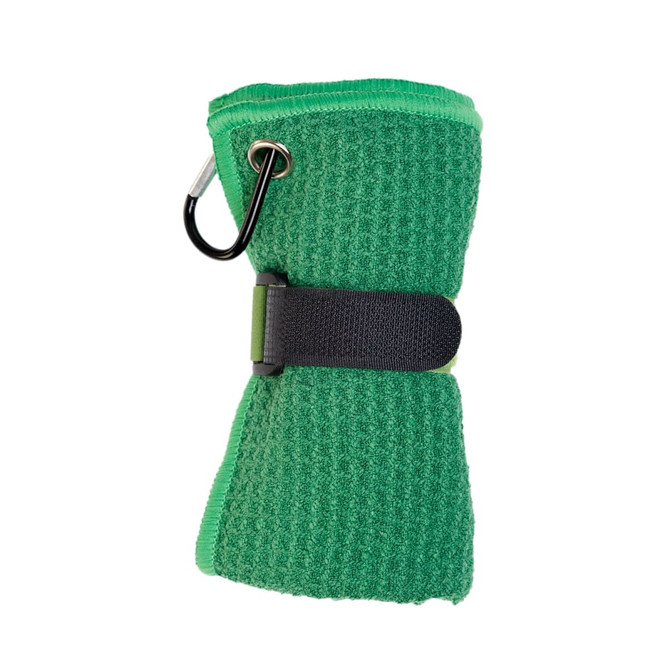 A green Rhino Travel Towel wrapped and secured with a black strap, featuring a carabiner for attachment.