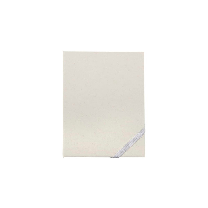A cream-coloured Trip Daily Planner with a grey elastic band for closure, featuring a simple, minimalistic design.