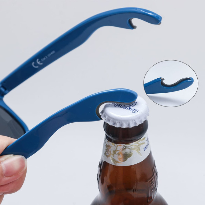 A blue bottle opener sunglasses with a bottle cap opener feature, held above a drink bottle.